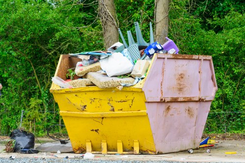 Company van at a commercial waste site approaching bins
